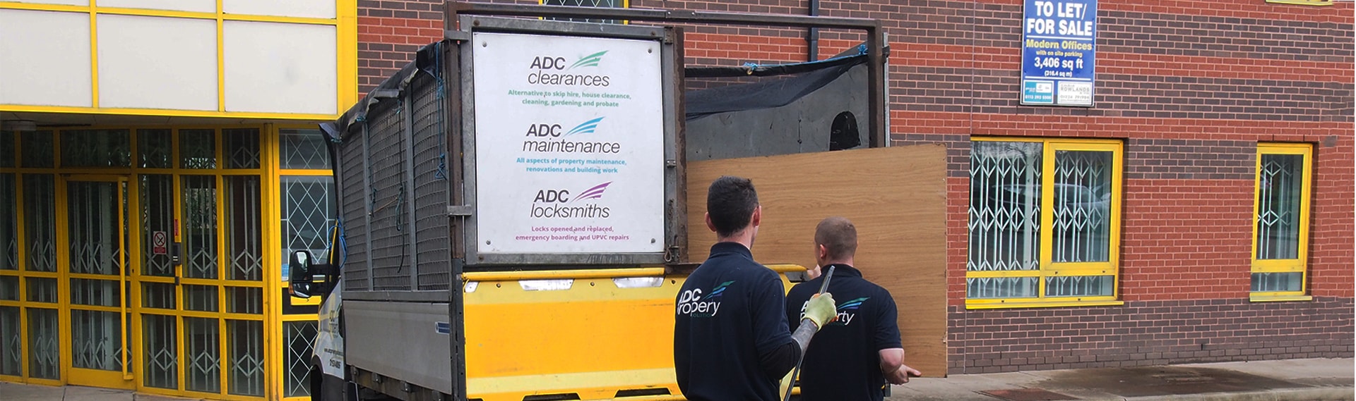 ADC team clearing materials with their branded works truck